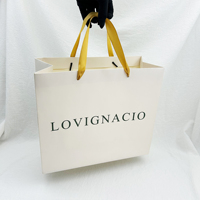 Bolsa de papel de compras reutilizable con impresión de logotipo personalizado de marca de lujo reciclable con asa de cinta