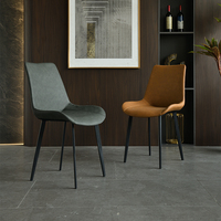 Chaise de salle à manger en métal de style minimaliste italien haut de gamme avec dossier en cuir noir, design luxe léger, démontable pour usage domestique ou hôtelier