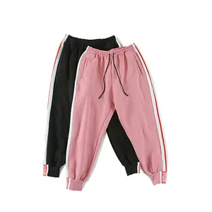 Celana harem olahraga pria, bawahan hip hop longgar bergaris, pink musim gugur