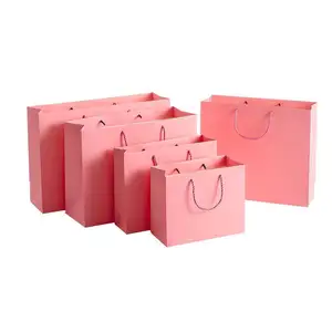 Bolsa de papel de compras rosa al por mayor personalizada con bolsa de regalo con logotipo para cumpleaños, bolsa de regalo de Papel kraft de Navidad con asa