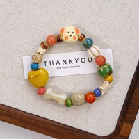 Source d'approvisionnement de bracelet en céramique Jingdezhen: bijoux de dessins animés frais et mignons pour un bel été