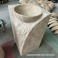 Évier en travertin naturel monobloc sculpté avec texture brute ciselée pour la rénovation des salles de bain de villas et d'hôtels