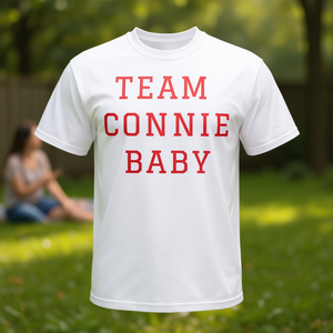 Camiseta Promocional Blanca con Cuello Redondo para Bebés del Equipo Connie - Product Image 1