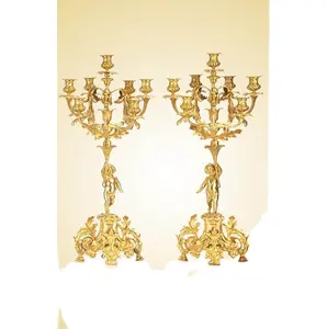 A pair of brass 24 K Gold Plated Gilt Dedicated Boys candle holder candle sticks for church, religious Activities