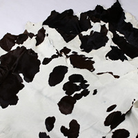Peau de veau naturelle noire et blanche avec poils
