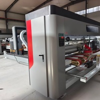 Machine automatique de pliage et de collage de cartons ondulés avec fonction de regroupement