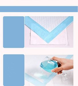 Muestra Gratis: Almohadillas Adhesivas para Perros de 22x22 y 28x30 Pulgadas, Blancas con Carbón, para Entrenamiento de Cachorros y Perros - Product Image 3