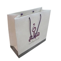Sac fourre-tout en papier kraft personnalisé avec logo imprimé, idéal pour l'emballage de vêtements, chaussures et cadeaux, vente en gros, avec poignée