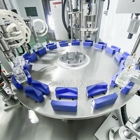 Machine de remplissage, de scellement et de bouchage rotative multifonctionnelle pour flacons de parfum CYJX