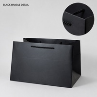 Sac shopping en papier noir A4 avec poignée en corde, design rectangulaire peu profond, pour cadeaux, événements commerciaux, vente en gros et impression personnalisée
