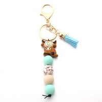 Porte-clés en forme de vache, porte-clés en silicone souple avec perles et pompons colorés, accessoires pour femmes et hommes