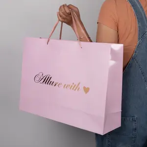 Disesuaikan pink pakaian kemasan toko kardus paperbag putih merek mewah kraft hadiah tas belanja kertas dengan logo Anda sendiri