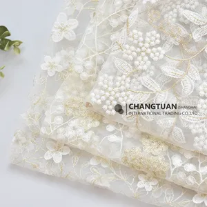 Venta al por mayor de tela de tul bordado floral para la boda vestido de mujer tela de encaje bordado de red seda de leche