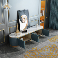 Meuble de salon de luxe de conception italienne, table TV avec plateau en marbre, pieds en acier inoxydable, support TV rembourré en cuir
