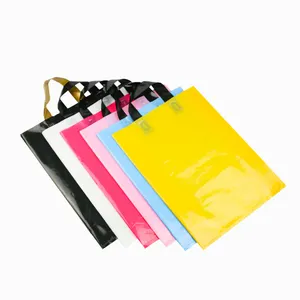 Bolsas de plástico rosa con logotipo personalizado para compras, bolsa de plástico con asa suave para ropa