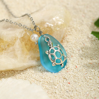 Collier Hawaïen en Gros avec Pendentif Tortue/Dolphin/Coquillage en Perle d'Eau Douce et Pierre Givrée en Verre de Mer