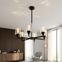 Lustre de style farmhouse à 6 lumières, structure en métal noir avec bras croisés, abat-jour cylindriques en verre transparent, luminaire de plafond avec douille E26