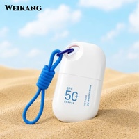 Mini flacon de crème solaire en forme de capsule 40 ml, format voyage, avec cordon détachable et porte-clés, portable pour la plage et les activités de plein air