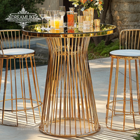 Table de bar ronde de luxe contemporaine en acier inoxydable avec plateau en verre et accoudoirs pour hôtel ou mariage, bar à cocktails haut de gamme