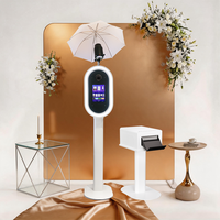 Photomaton ovale pour iPad, très demandé, en métal épaissi avec revêtement par pulvérisation haute température et éclairage RGB contrôlé par application, portable.