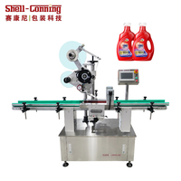 Machine d'étiquetage automatique professionnelle pour bouteilles et canettes de l'industrie alimentaire, personnalisable en usine, avec système de serrage automatique et étiquetage plan.