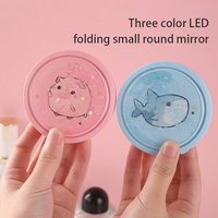 Miroir cosmétique LED portable pour femmes, idéal pour les voyages, double face, pliable, forme ovale, avec éclairage intégré et cadre en plastique