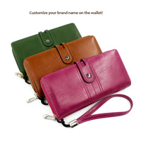 Portefeuille long en cuir PU pour femme, style vintage, avec dragonne, grande capacité, porte-cartes et téléphone, vente en gros OEM