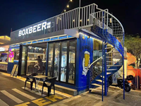 Conteneur d'expédition préfabriqué de 20 pieds, structure en acier, café ou restaurant éphémère pour utilisation en extérieur, matériau en panneaux sandwich