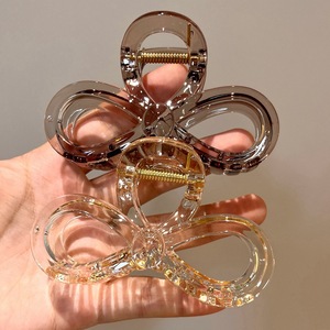 Nouvelle pince à cheveux de style haut de gamme en forme de nœud pour femme, pour une coiffure mi-attachée à l'arrière de la tête. Vente en gros disponible. - Product Image 4