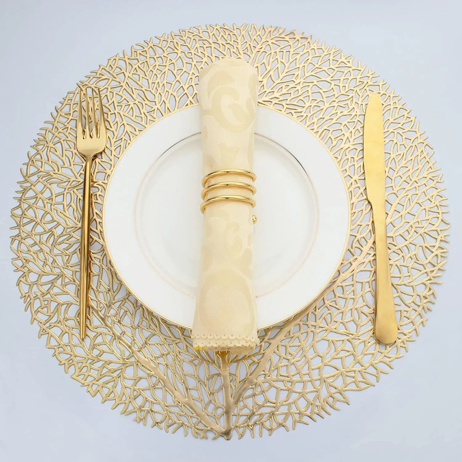 2023 Tabletex hot sale hollow design tree leaf round 38cm PVC placemat gold table mat