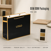 Sacs shopping en papier noir et or OEM, logo personnalisé, poignées en corde, pour vêtements, cadeaux, emballage de détail, vente en gros, marque privée