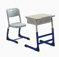 Ensemble table et chaise d'école réglables en hauteur en mélamine avec boîte à livres perforée et structure en acier pour salle de classe primaire