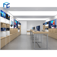 Mobilier pour atelier de réparation d'ordinateurs Moderne-computer-shop-interior-design Comptoir en bois Vitrine murale pour décoration de magasin de téléphonie