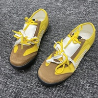 Sepatu kets biskuit kuning wanita, gaya Niche, warna kontras, High-end Sense, sepatu datar kasual untuk wanita
