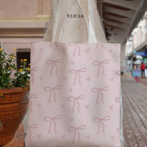 กระเป๋าผ้าแคนวาสพิมพ์ลายโบว์สีชมพู กระเป๋าสะพายช้อปปิ้งแบบใช้ซ้ำได้ กระเป๋าใส่ของอเนกประสงค์แบบนุ่มสำหรับชายหาด โรงเรียน ร้านขายของชำ - Product Image 3