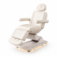Table de massage électrique pliable de luxe en acier inoxydable réglable avec repose-pieds pour salon, spa et soins de la peau