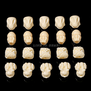 <span class=keywords><strong>JD</strong></span> Vente en gros Fait à la main Sculpté Naturel Naturel Phytelephas Macrocarpa Ivoire Noix Animal Forme Charme Perles D'espacement Pour La Fabrication de Bijoux - Product Image 2