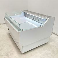 Réfrigérateur commercial vitré incurvé à température unique pour la présentation de poissons, viandes et fruits de mer frais, avec refroidissement par air