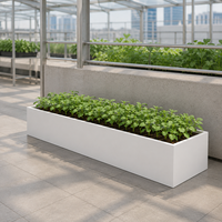 Jardinière rectangulaire longue en métal sur pied pour semis de serre commerciale, idéale pour la culture de légumes et d'herbes en pépinière