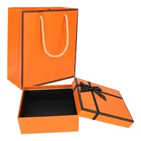 Grand emballage pliable en papier rigide avec logo personnalisé Boîte cadeau pliable avec poignée en ruban