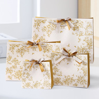 Sacs cadeaux en papier laminé de luxe personnalisés avec logo et poignées pour l'emballage commercial de Noël, vente au détail, shopping