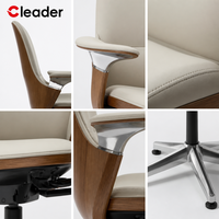Chaise de bureau professionnelle en cuir, dossier haut, pivotante, réglable en hauteur, rembourrée et tapissée, avec base fixe et commande au pied.
