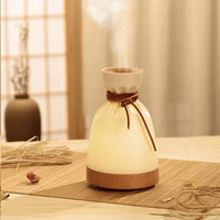 Diffuseur d'arômes créatif en forme de pochette avec base en bois, humidificateur ultrasonique d'huiles essentielles, attache en cuir pour chambre, spa, boutique, cadeau