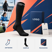 Chaussettes de compression noires avec logo, support du mollet à compression graduée, bordure large, pointe plate, avec tableau de mesure, vérifiées pour le travail