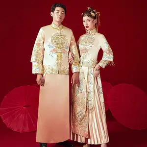 黄金のウェディングドレスの花嫁 Suppliers-2020新しい中国の伝統的な結婚式の花嫁と花婿はドラゴンとフェニックスのガウンの黄金のウェディングドレスを着用します