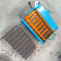 Machine manuelle mobile de fabrication de blocs de béton utilisant une machine à fabriquer des briques et une machine à fabriquer des briques en ciment non cuites