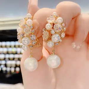 Pendientes de perlas con forma de flor salvaje para mujer, aretes con diseño de moda super parpadeante, concha de aguja de plata S925, Japón y Corea del Sur