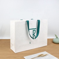 Sac en papier de shopping pour emballage de bijoux de luxe, avec ruban intégré en poignée, personnalisation du logo