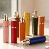 Flacon pulvérisateur de parfum miniature 5ml 10ml, cylindrique, avec coque en cuir PU, accent argenté, intérieur en aluminium, rechargeable, cadeau de luxe