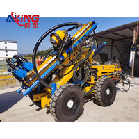 Plateforme de forage hydraulique intégrée à changement automatique de tige de forage, pour forage en fond de trou et dynamitage de goujons rocheux